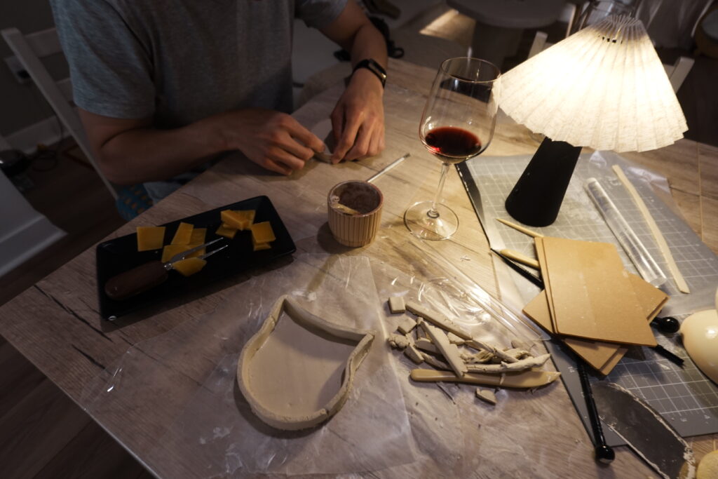 shaping trinket tray at home on an air dry clay date night