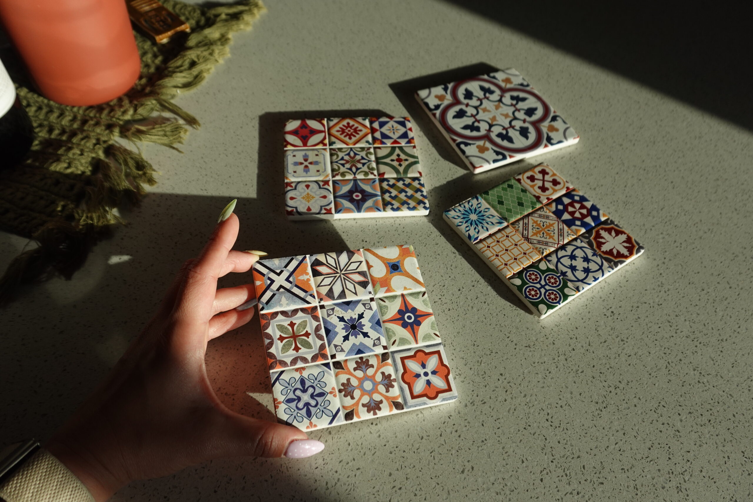 hand holding some Spanish tiles