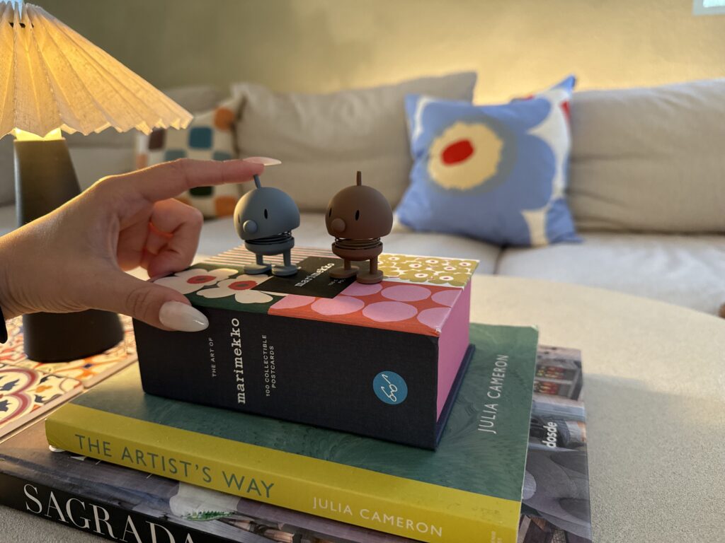 Hoptimist figures from Denmark styled as travel souvenir coffee table decor
