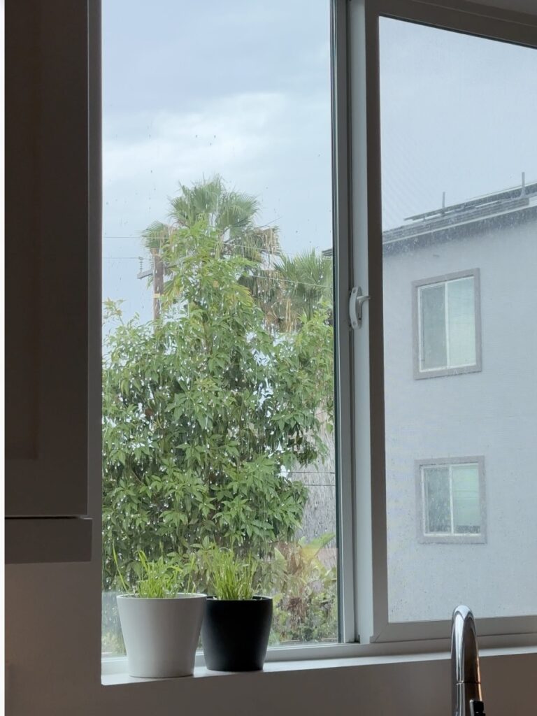 plain white vinyl sliding kitchen window before adding grids