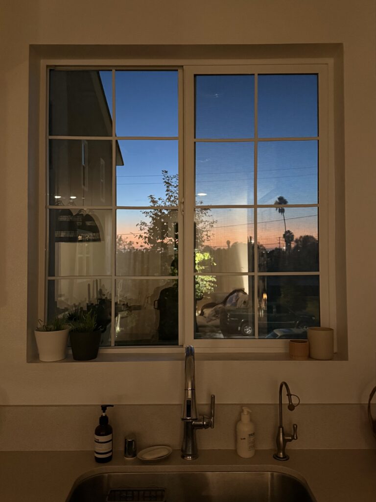 kitchen window with faux grids at night